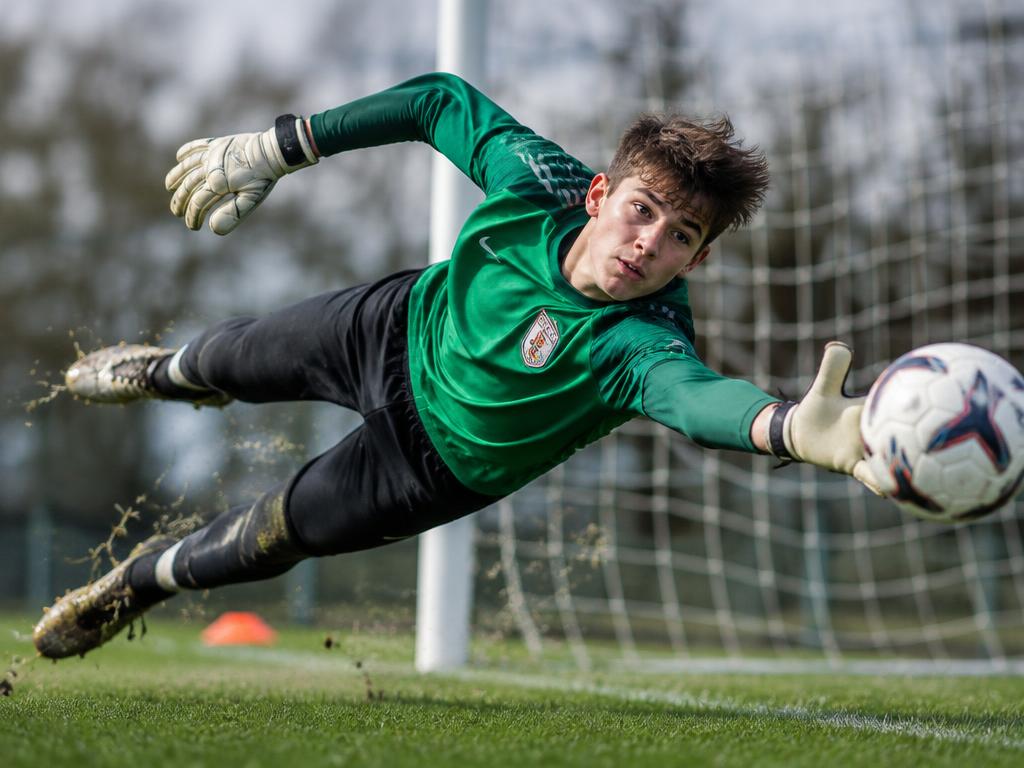 Noah Kowalski diving to make a save
